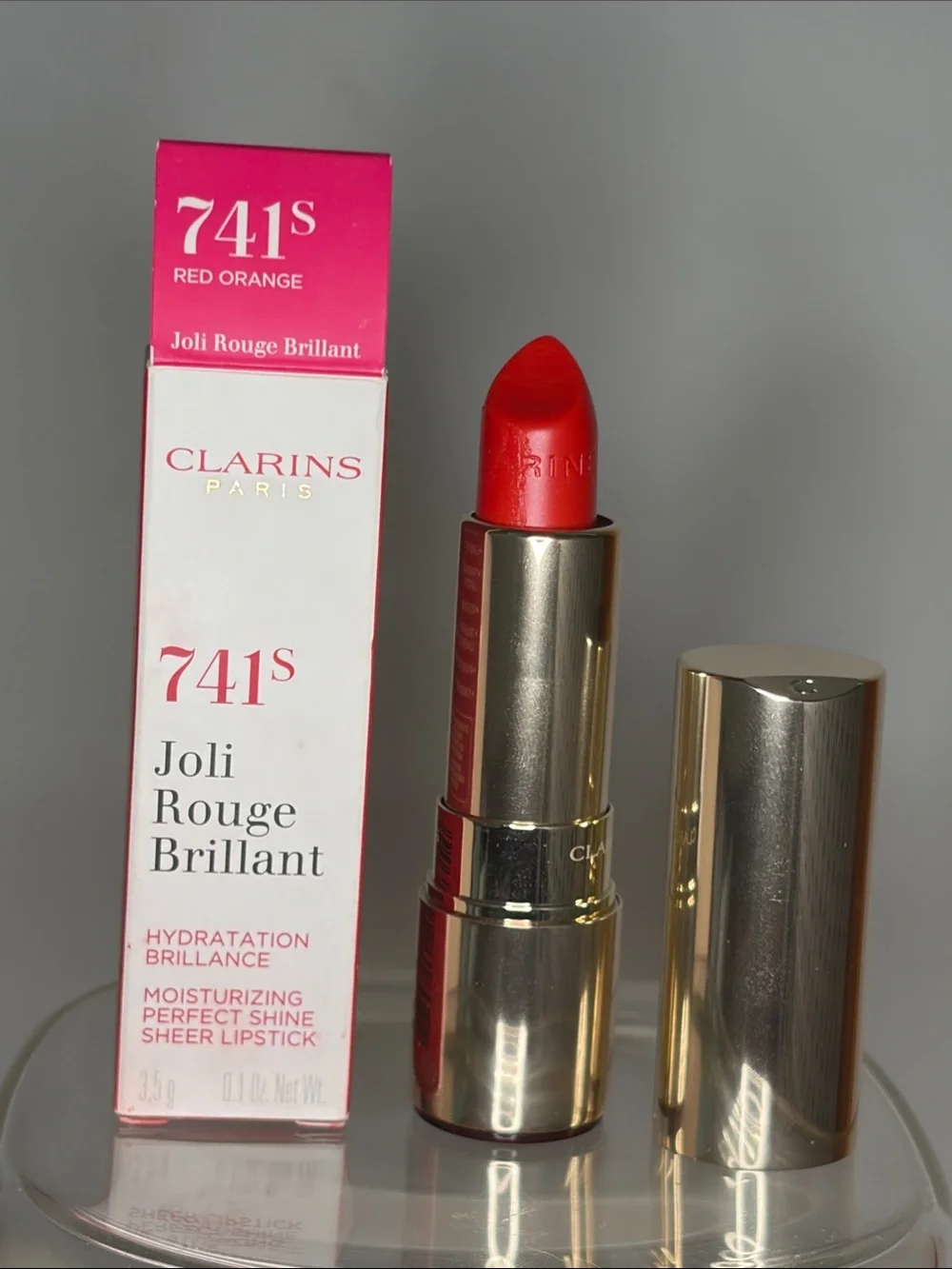 Clarins Joli Rouge Brillant Lipstick in Red-Orange last photo slight smudge